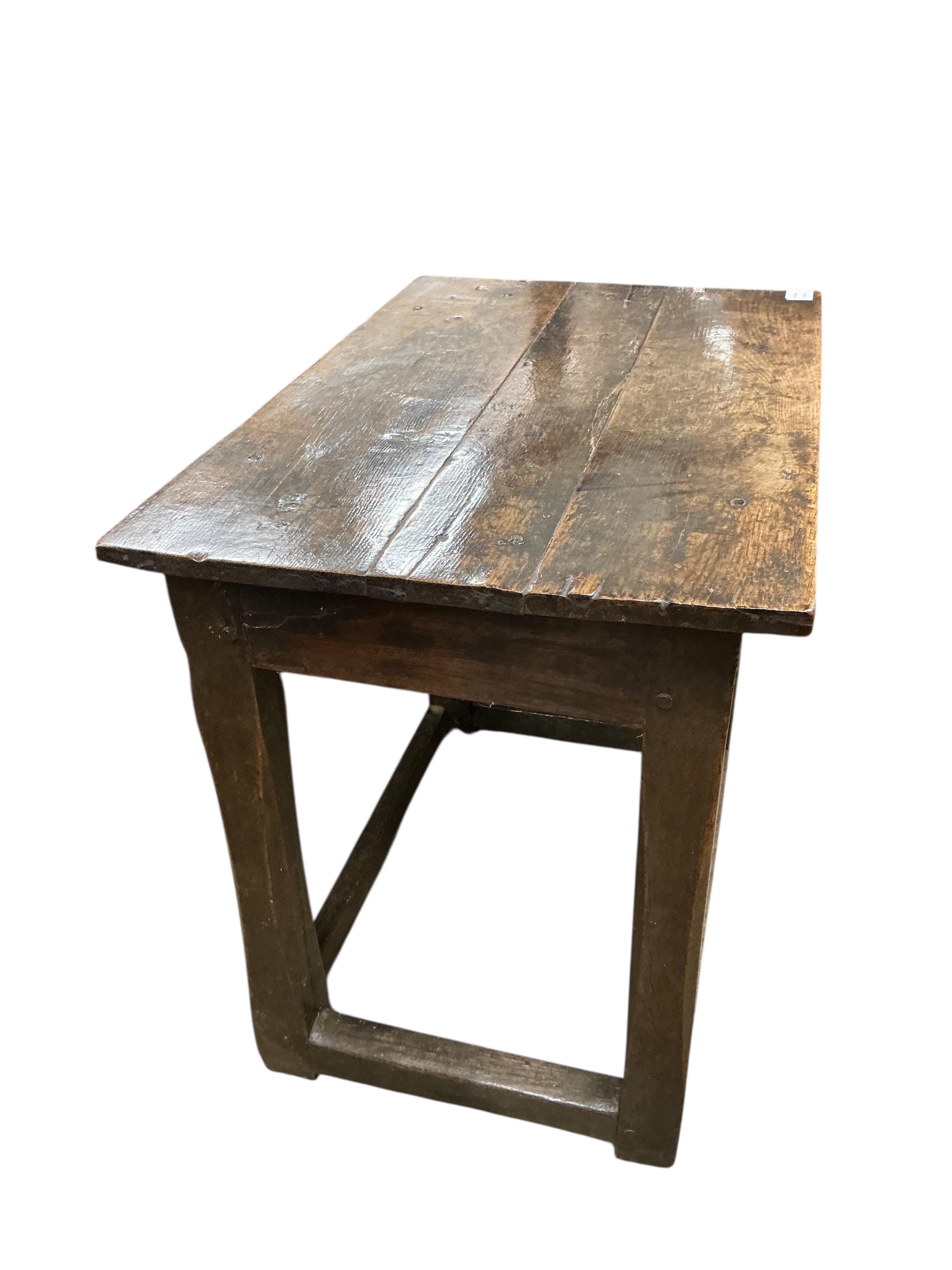 A small late 17th century oak side table, the rectangular top on square chamfered supports, width 80cm, depth 53cm, height 71cm